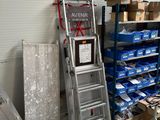 many boxes and ladders in a room with a lot of boxes