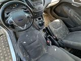 a dirty car with a steering wheel and a dashboard