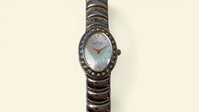 an image of a woman ' s wrist watch with a mother of pearl dial