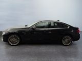 the bmw 6 series sedan is parked in a showroom