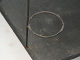 a metal tray with a hole in the middle of it