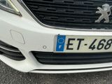 a close up of a car with a number plate on the front of it