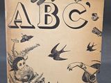 an old book with a picture of a hand and a bird on it