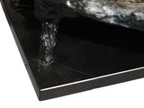 a sculpture of a bird sitting on top of a black table