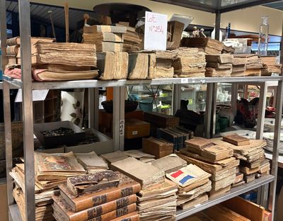 many stacks of books on the shelves in the store