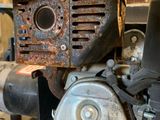 a small engine that is sitting on a wooden pallet