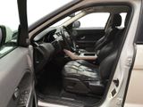 the interior of a car with the door open showing the driver ' s seat