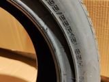 tire tread of a car on a cardboard box with a cardboard box in the background