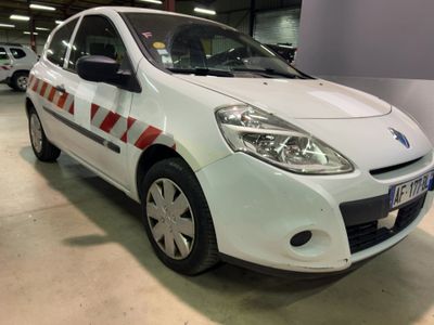 a picture of a white car parked in a garage
