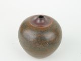 an image of a brown vase on a white surface