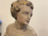 a statue of a woman holding a baby in her arms