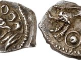 a silver coin with an image of a man on it