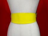 a close up of a mannequin torso with a yellow belt