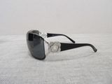 chanel sunglasses with black frame and silver logo on the side
