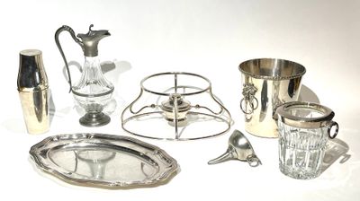 a silver plate and silverware on a white table