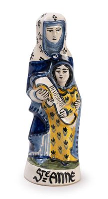 ceramic figurine of a woman holding a baby in her arms