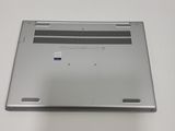 a silver laptop that is sitting on a table