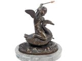statue of a woman sitting on top of a bird on a marble base