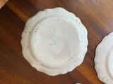 two plates that are sitting on a wooden table