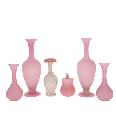 five vases and a small vase on a white background