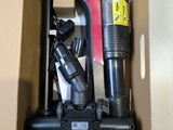 a box with a vacuum and other items inside of it