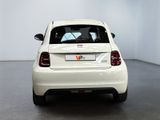 a white car that is parked in a room