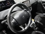the interior of a car with a steering wheel and dashboard controls