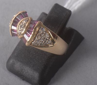 an image of a pink and white diamond ring sitting on top of a black ring holder