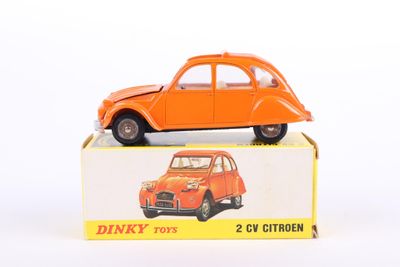 an orange toy car sitting on top of a box