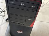 a computer tower with a keyboard and mouse on top of it