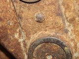 a close up view of a rusted metal door handle