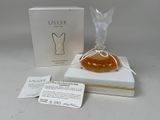 an image of a bottle of perfume sitting on top of a white box