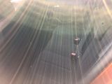 a seat in the back of a car with the sun shining through it