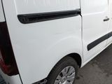 a white van that is parked in a parking lot