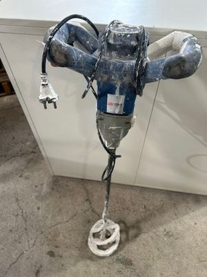 an image of a drill in a room with a white counter