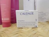 many different types of skin care products sitting on a table
