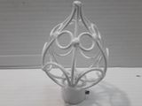 a white vase that is sitting on a table