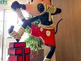 statue of mickey mouse in the lobby of a hotel
