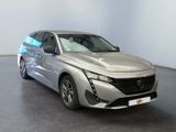 the silver car is parked in a large room with a black floor