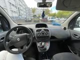 dashboard view of a small car driving down a city street