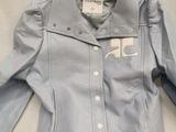 blue denim jacket with white letters on the chest and collar