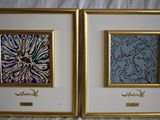 two framed paintings of a woman and a man on a bed
