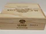 a wooden box with a label on it on a table