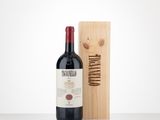 the bottle of wine is next to a wooden box