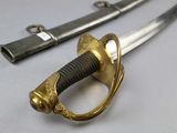 a close up of a pair of swords on a table