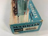 an old box with a train on it sitting on a table