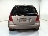 a silver car that is parked in a white room