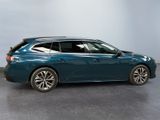 the blue car is parked in a room with a gray floor
