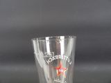 a shot glass with a red star on the side of it