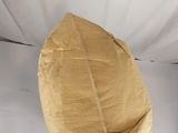 a brown paper bag on top of a white sheet